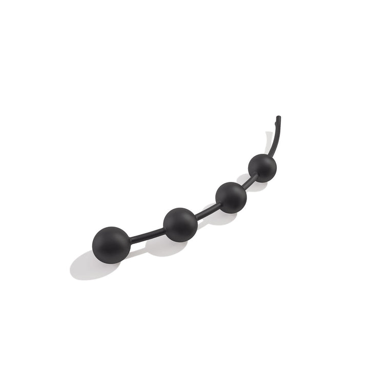 Black anal chain with four smooth round beads connected by a flexible silicone string.