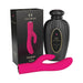 Pink dual-action Mystique Rabbit vibrator with textured black storage bottle and branded packaging box.