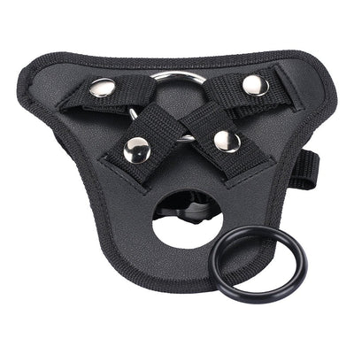 Black adjustable strap-on harness with metal ring and removable silicone ring accessory.