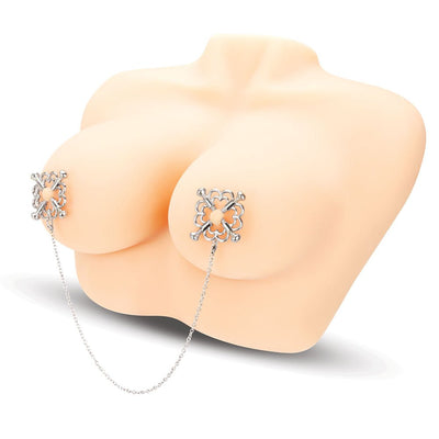 Silver flower design nipple clamps connected by a delicate chain displayed on a mannequin torso.