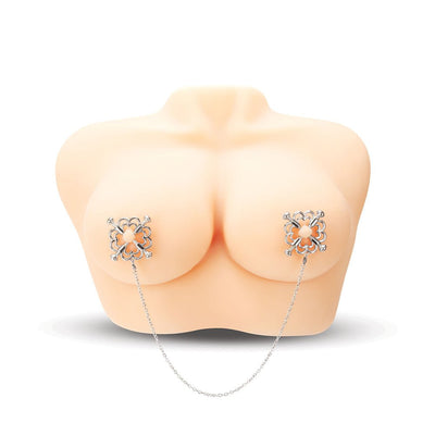 Silver flower design nipple clamps connected by a delicate chain on a mannequin torso.