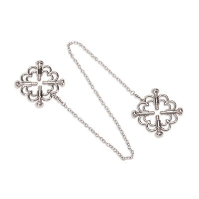 Silver flower-shaped nipple clamps connected by a delicate chain with adjustable grip screws.