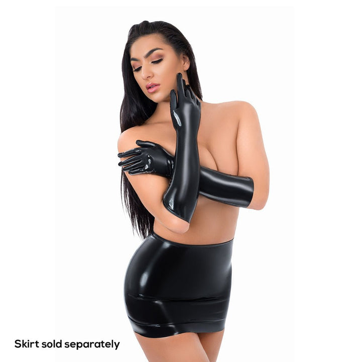 Model wearing glossy black full-length latex gloves and matching latex skirt against white background