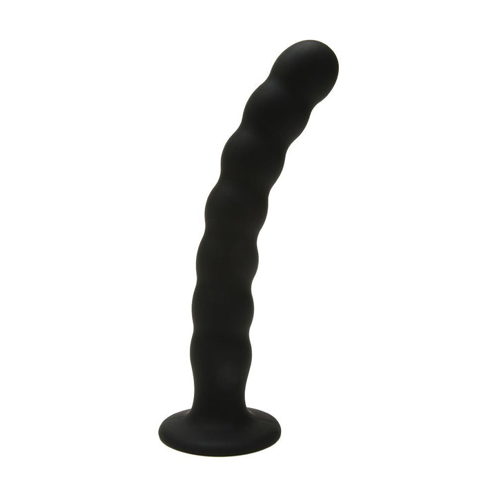 Black silicone G-spot peg with ripple texture and curved design for targeted stimulation, standing on a flat base.