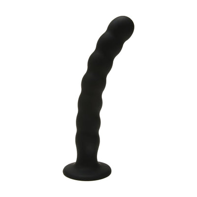 Black silicone G-spot peg with ripple texture and curved design for targeted stimulation, standing on a flat base.