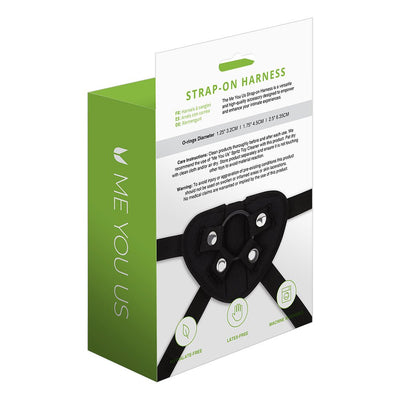 Packaging of Me You Us black strap-on harness with care instructions and product features displayed.