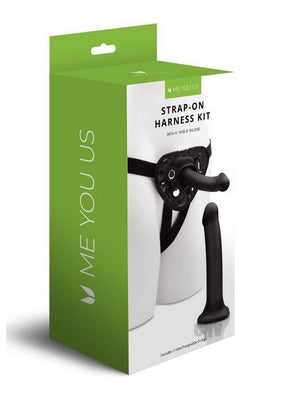 Packaging of Me You Us strap-on harness kit featuring black harness and two interchangeable dildos in 6 and 8 inch sizes.