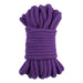 Coiled 10-meter purple cotton rope designed for comfortable and versatile bondage play.