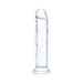 Transparent flexible dildo with flared base and realistic texture standing upright on white background