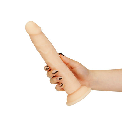 Hand holding a 9-inch bendable dual-density silicone dildo with suction base in vanilla color.