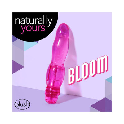 Pink translucent flexible vibrator with curved design, displayed on a lavender background with Naturally Yours branding.