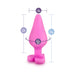 Pink silicone anal plug with heart-shaped base, showing dimensions of 3.5 inches length and 1.5 inches width.