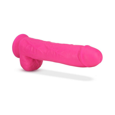 Bright pink 11-inch dual density dildo with suction cup base and realistic texture on white background.