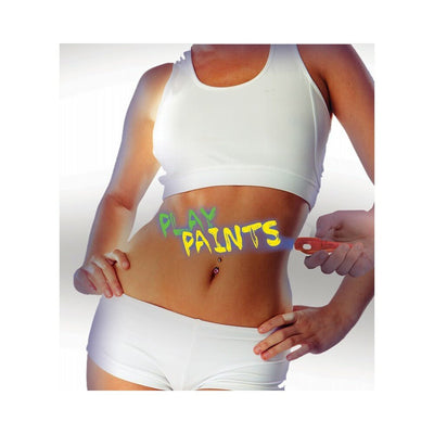 Close-up of a person in white activewear with neon body paint words "PLAY PAINTS" on their stomach, highlighted by a handheld UV light.