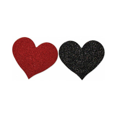 Pair of glittery heart-shaped pasties in red and black colors on a white background.