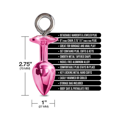 Pink metal tapered butt plug with a jeweled handle, shown with size dimensions and product feature text.