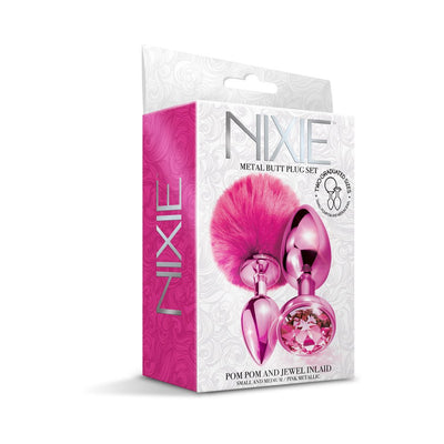 Packaging of Nixie Metal Butt Plug Set featuring two pink metallic plugs with pom pom and jewel accents.