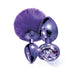 Set of two metallic purple butt plugs, one with a fluffy pom pom tail and the other with a faceted jewel base.