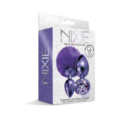 Nixie Metal Butt Plug Set with purple pom pom tail and jewel-inlaid metallic plugs in small and medium sizes in decorative packaging.