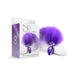 Purple metallic metal butt plug with ombre purple and white faux fur tail next to matching product packaging box