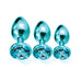 Three graduated blue metal butt plugs with jeweled bases displayed on a white background.