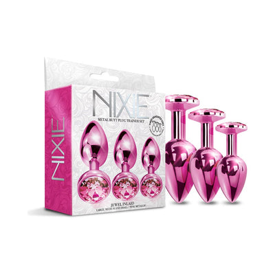 Three-piece pink metallic metal butt plug trainer set with jeweled bases displayed next to decorative packaging box.