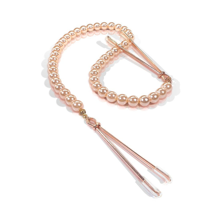 Rose gold tweezer nipple clamps connected by a strand of soft pink pearl beads with clear rubber tips.