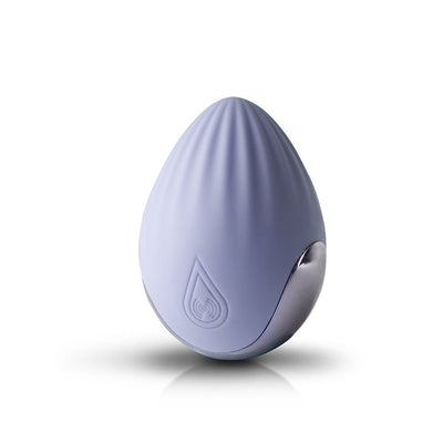 Cornflower blue silicone palm-held massager with textured surface and silver accent, standing upright on white background.