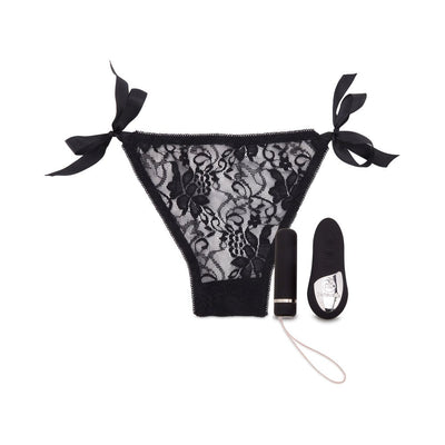 Black lace pleasure panty with side ties, paired with a sleek bullet vibrator and remote control.