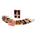 Deck of Nude Playing Cards with artistic nude photography displayed in a fanned arrangement beside a red tuck box.