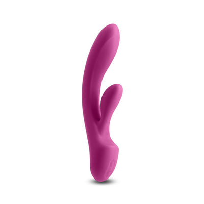 Dark pink silicone dual-stimulation vibrator with ergonomic curves and control buttons at the base.
