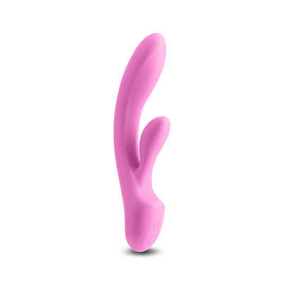 Pink silicone dual-stimulation vibrator with curved design and control buttons at the base.