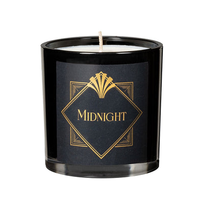 Black glass candle with gold "Midnight" label and white wax inside, single wick unlit.