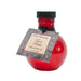 Round red glass bottle of Olivia's Boudoir Rose Petals massage and body oil with black cap and decorative label tag.