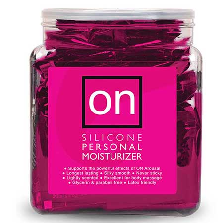 Clear jar filled with individually wrapped On Silicone Personal Moisturizer samples in bright pink packaging