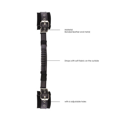 Black and white bonded leather handcuffs with adjustable straps, soft fabric lining, metal buckles, and a central handle for grip.