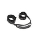 Black bonded leather adjustable handcuffs with metal buckles and a textured handle strap.