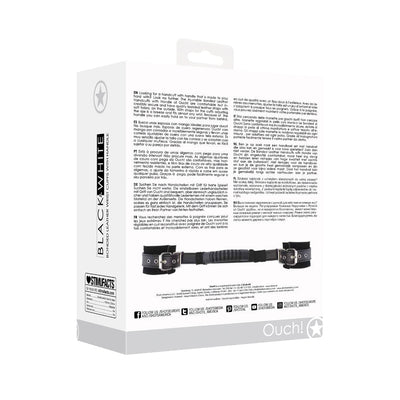 Packaging box of Ouch! Black & White bonded leather handcuffs with handle and adjustable straps shown from the back.