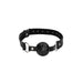 Black breathable ball gag with adjustable bonded leather straps and metal buckle closure on white background.