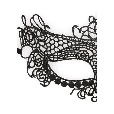 Close-up of black lace eye mask with intricate swirling and floral patterns, designed for elegant masquerade or costume events.