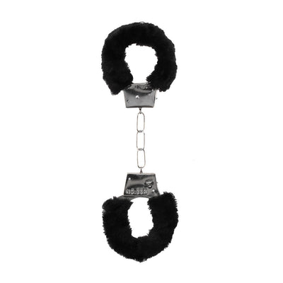 Black and white furry handcuffs with metal chain and quick-release button for comfortable restraint play.