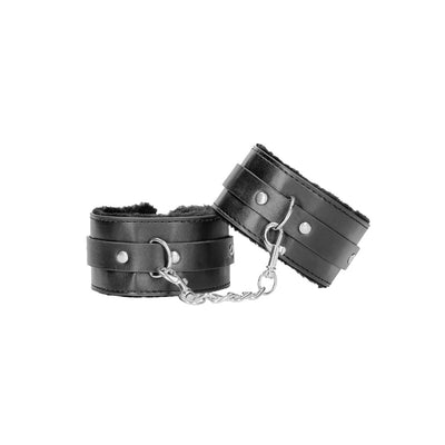 Black and white plush bonded leather ankle cuffs with adjustable straps and a connecting metal chain.