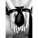 Black satin bondage tie securing hands behind back with lace lingerie visible in black and white photo.