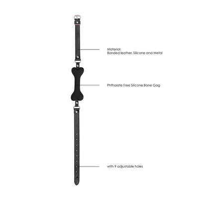 Black silicone bone-shaped gag with adjustable black bonded leather straps and metal hardware shown on white background.
