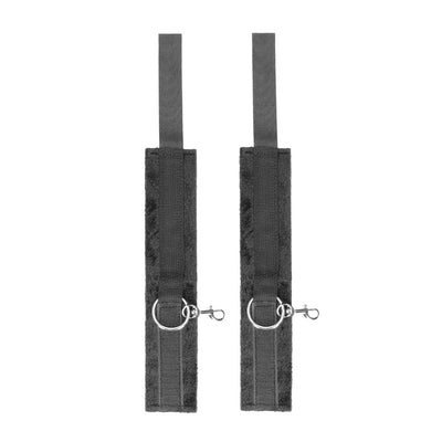Pair of black velcro cuffs with soft lining and metal D-rings and clips for secure attachment.