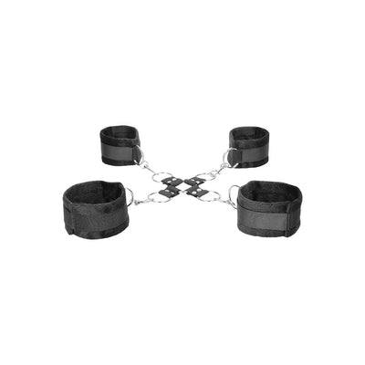 Black and white velcro hogtie with soft padded cuffs connected by metal rings and straps.