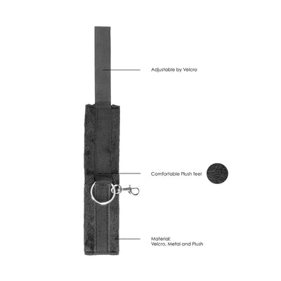 Black plush velcro cuff with metal ring and clip, adjustable for comfortable hand or ankle restraint.