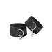 Pair of black velcro cuffs with soft lining and metal D-rings for secure attachment.