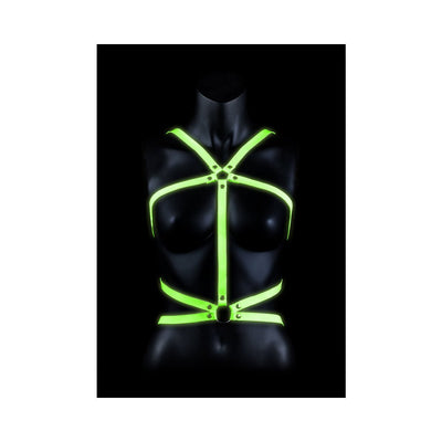 Black mannequin wearing a glowing green adjustable body harness with metal rings and straps.