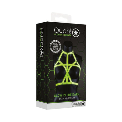 Packaging of Ouch! Glow in the Dark green bra harness displayed on a black mannequin bust with neon green straps.